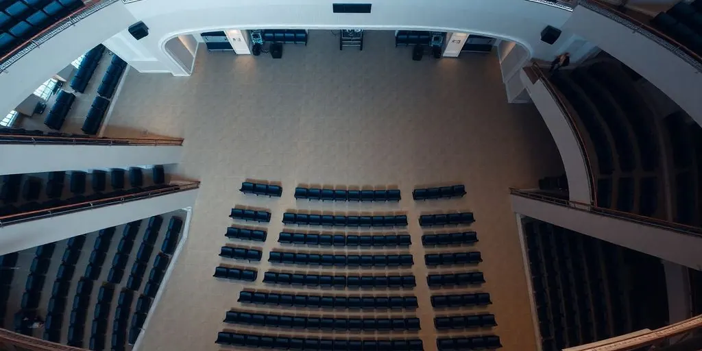 Overhead view of an empty venue with rows of seats.