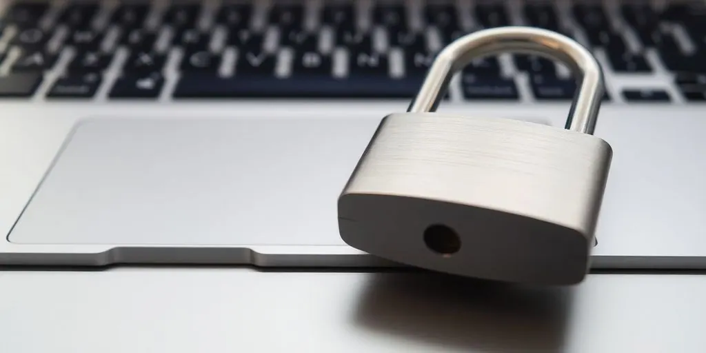 Padlock over a laptop keyboard. Cyber security.